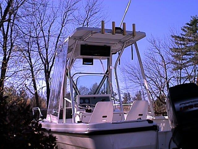 Atlantic Towers T-Top installed on a Trophy 1903 Center Console boat shown from the rear with two seats and trees in the background