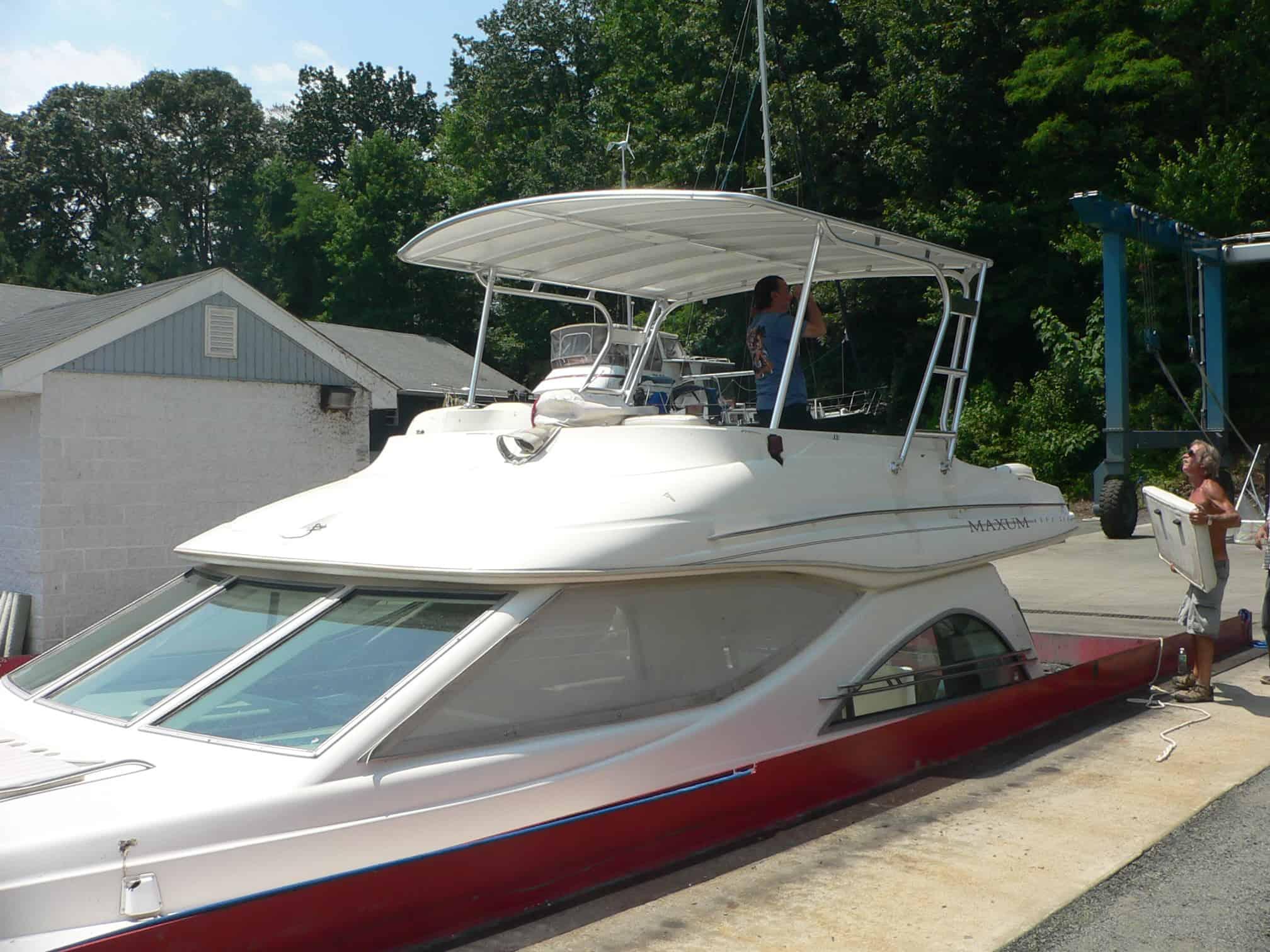 Atlantic Towers Top installed on a Maxum 4600 SCB sedan boat, showing the rear deck and surrounding railing.