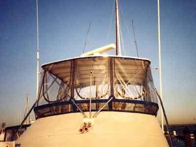 Atlantic Towers Top installed on the upper deck of a Silverton 40 Convertible boat at sunset.