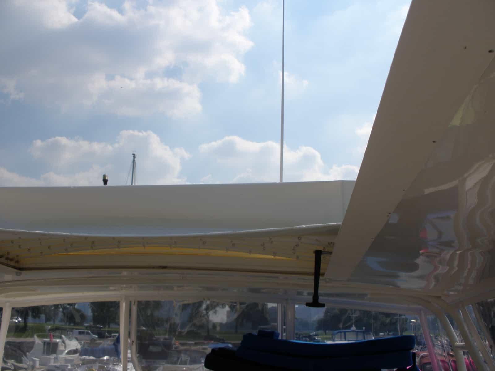 Atlantic Towers Accessories installed on a Silverton 43 Motor Yacht, view of the upper deck and clouds above.