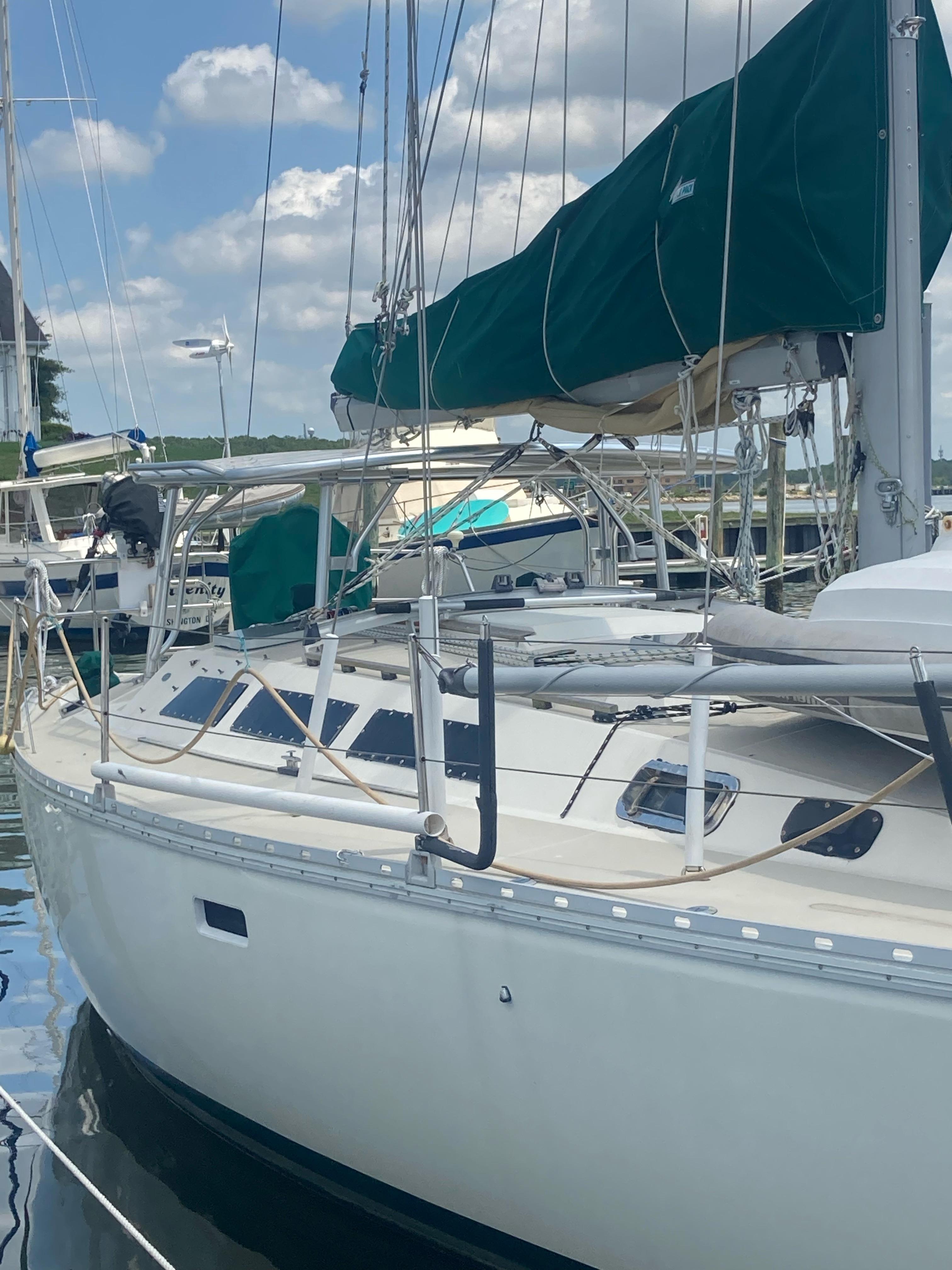 Atlantic Towers Top installed on an O'Day boat, docked in a marina with a green canopy and reflective water.