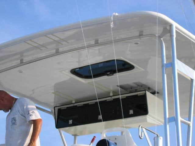 Bertram 46.6 Convertible boat with installed Atlantic Towers Top providing overhead shelter and mounting space on a sunny day.
