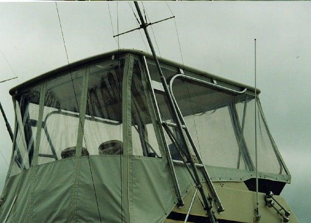 Atlantic Towers Top installed on a Chris Craft 36 Commander, featuring a clear enclosure and sturdy frame.