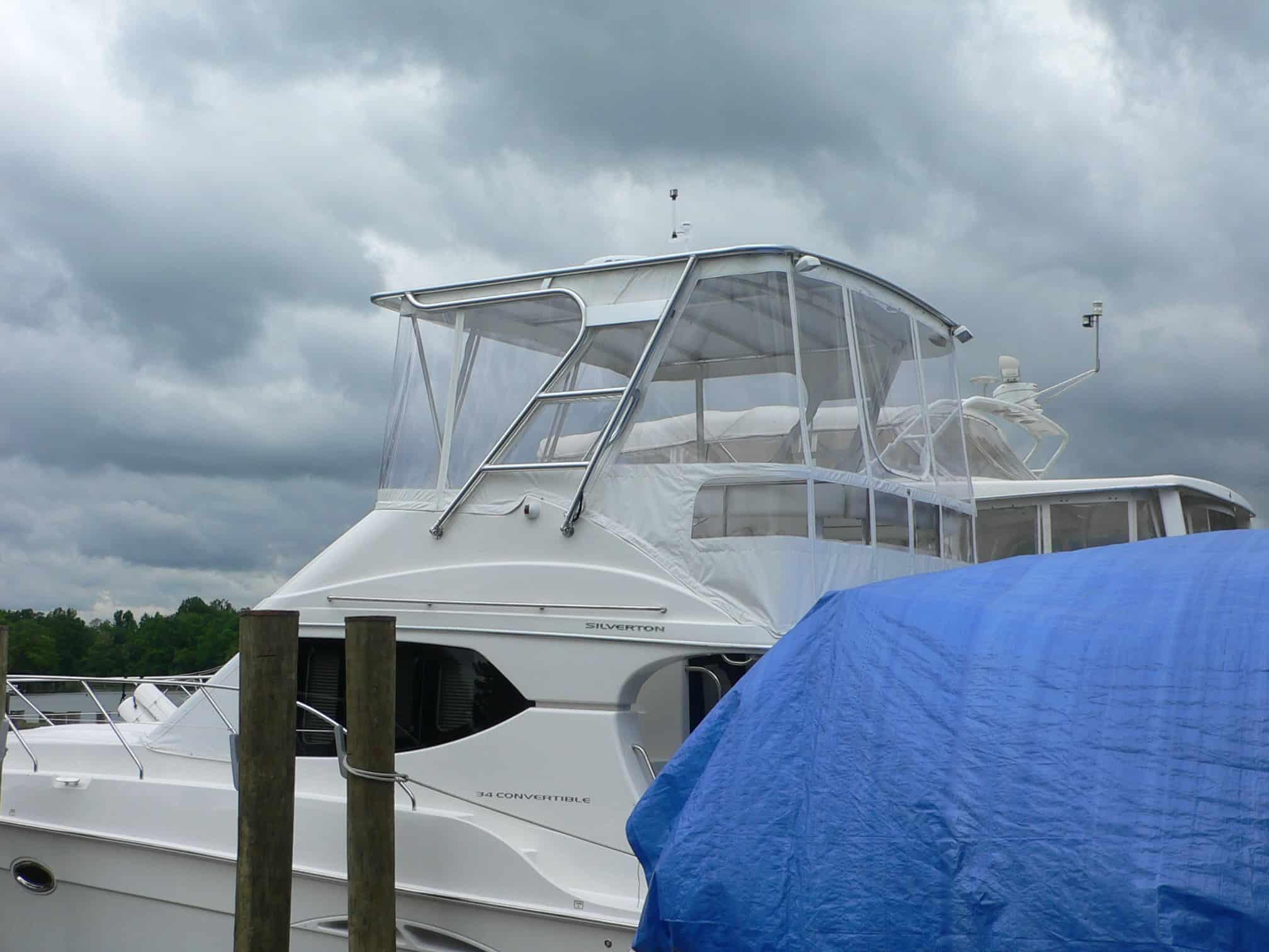 Atlantic Towers Top installed on Silverton 34 Convertible boat, showing sleek metal frame and cover for protection.