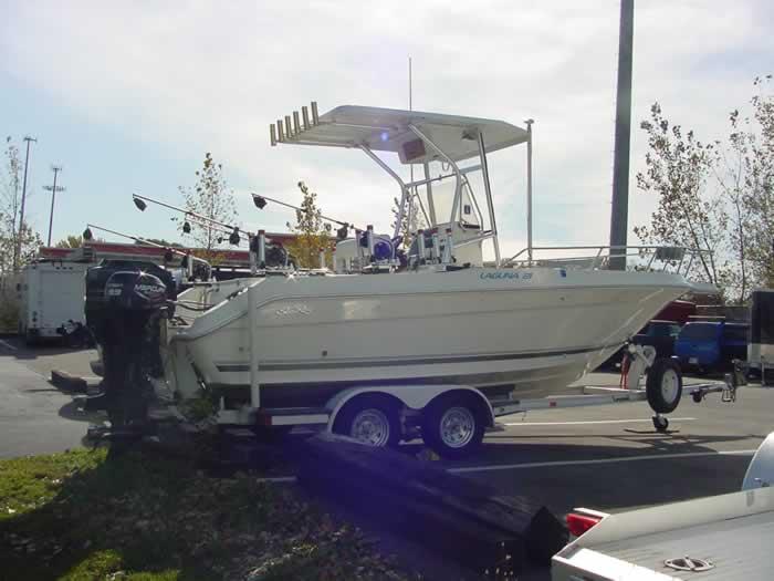 Atlantic Towers T-Top mounted on a Sea Ray 20 Laguna boat parked on a trailer in a marina.