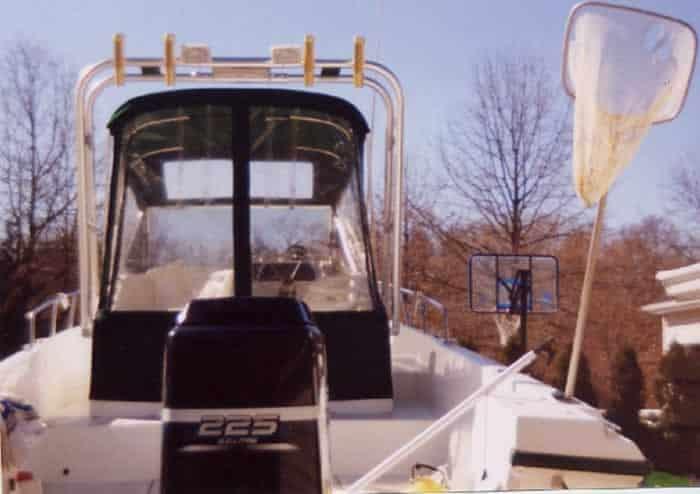 Atlantic Towers Arch installed on an Angler Boats 240, showcasing the boat's rear view and engine.