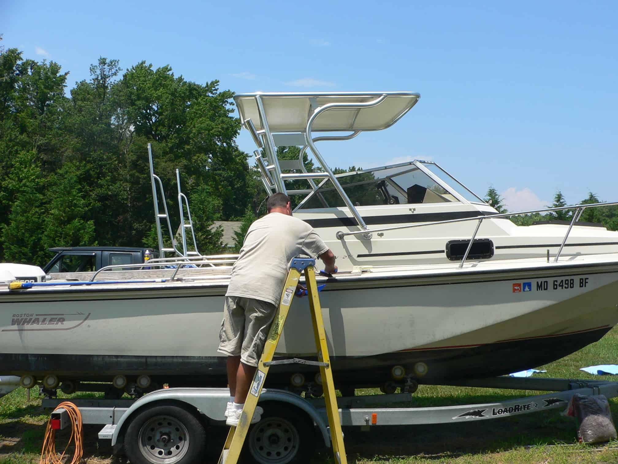 Atlantic Towers Top installed on a Boston Whaler 22 Revenge not walkthru cuddy boat, shown from the side.