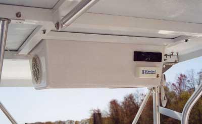 Atlantic Towers T-Top installed on an Aquasport 244 CCP boat showing overhead enclosure and mounted equipment.