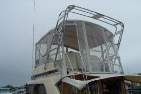Atlantic Towers Arch installed on a Chris Craft 360 Commander convertible boat, showing the framework and mounted equipment.