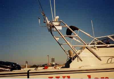 Atlantic Towers Arch installed on the Boston Whaler 25 Revenge Walkaround with fishing rod holders and outriggers