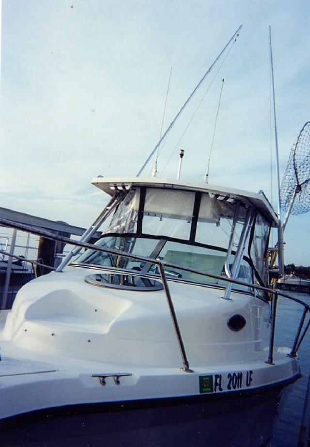 Atlantic Towers Accessories installed on a Seaswirl Walkaround boat, featuring a clear enclosure and fishing gear.