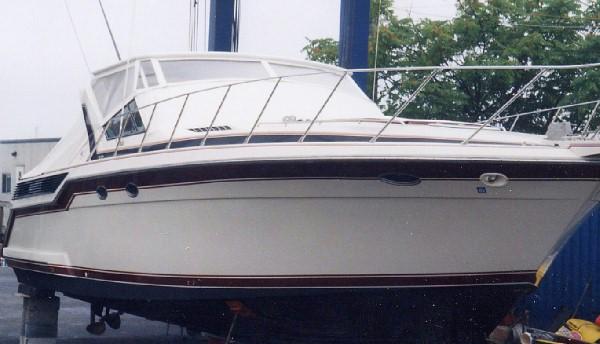 Atlantic Towers Top installed on a Wellcraft 43 Portofino boat, docked and lifted for maintenance.