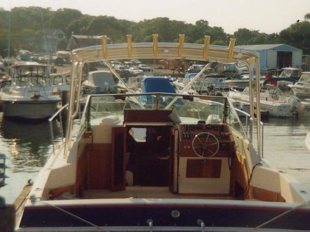 Atlantic Towers Top installed on a Wellcraft 288/2900 Express Suncruiser, docked among other boats in the marina.