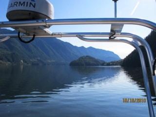 Atlantic Towers T-Top mounted on a boat with mountainous scenery and calm waters in the background.