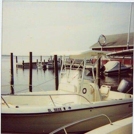 Sea Pro 206 Center Console boat docked with installed Atlantic Towers T-Top visible over the center console.