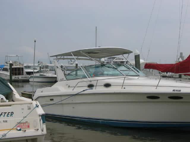Atlantic Towers Top installed on a white Sea Ray 340 Sundancer express cruiser boat docked at the marina.