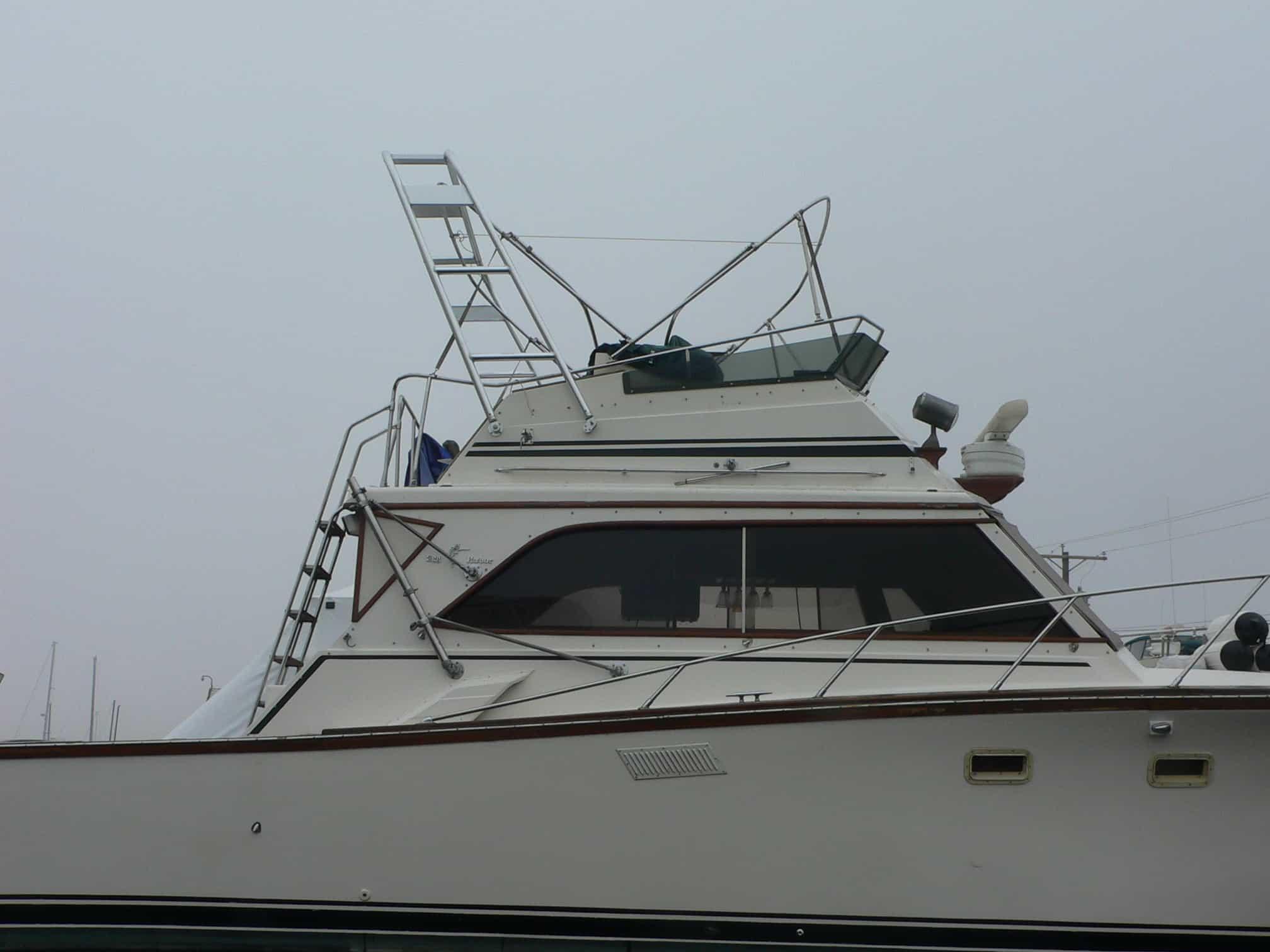 Atlantic Towers Arch installed on an Egg Harbor 36 Sedan boat, showcasing the upper deck and ladder details.