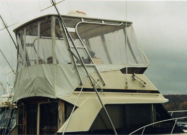 Atlantic Towers Top installed on the upper helm area of a Chris Craft 36 Commander boat in a marina setting.