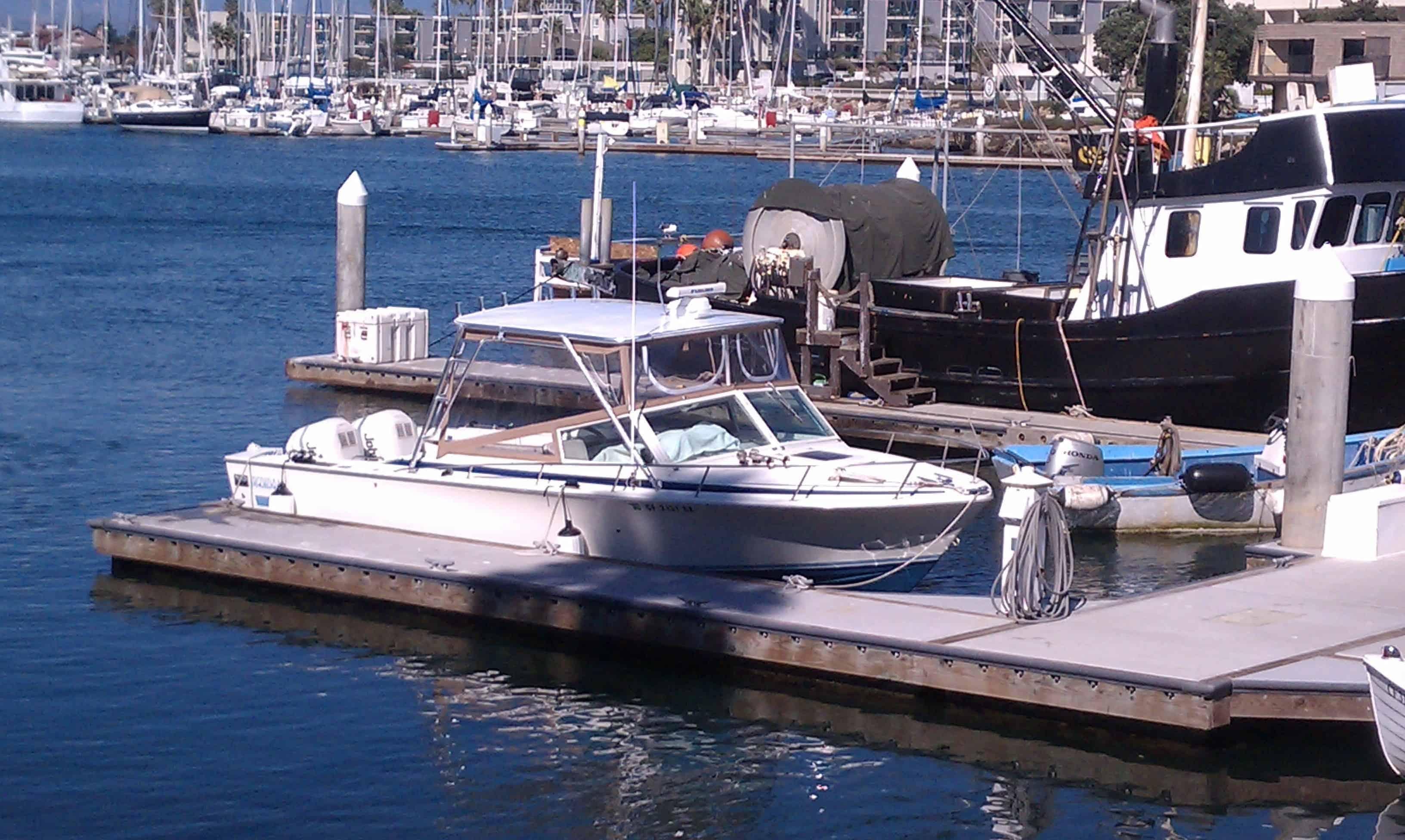 Atlantic Towers Top installed on a Bertram 26 Sport Convertible boat docked at the marina.