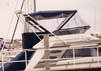 Atlantic Towers arch installed on a Sea Ray 430/440 Convertible yacht at a marina dock.