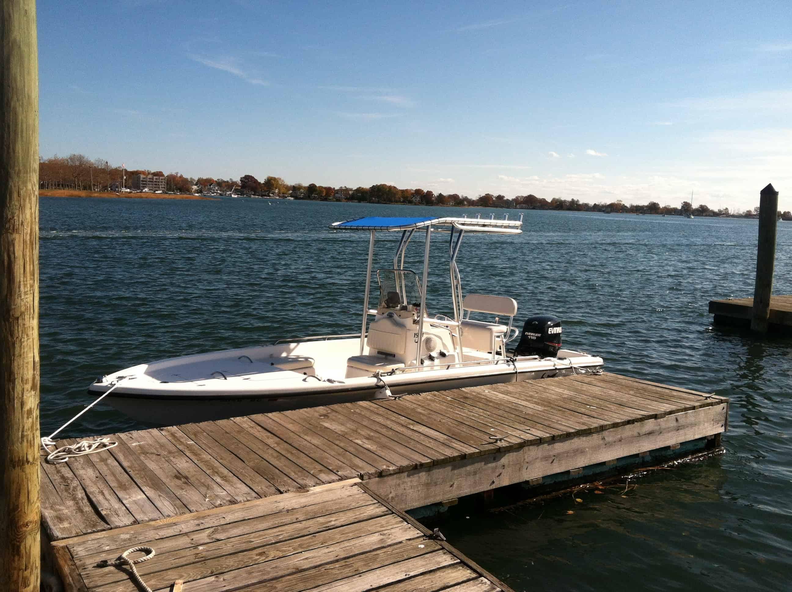 Atlantic Towers T-Top installed on a Mako 1801 center console boat shown from the side on water.