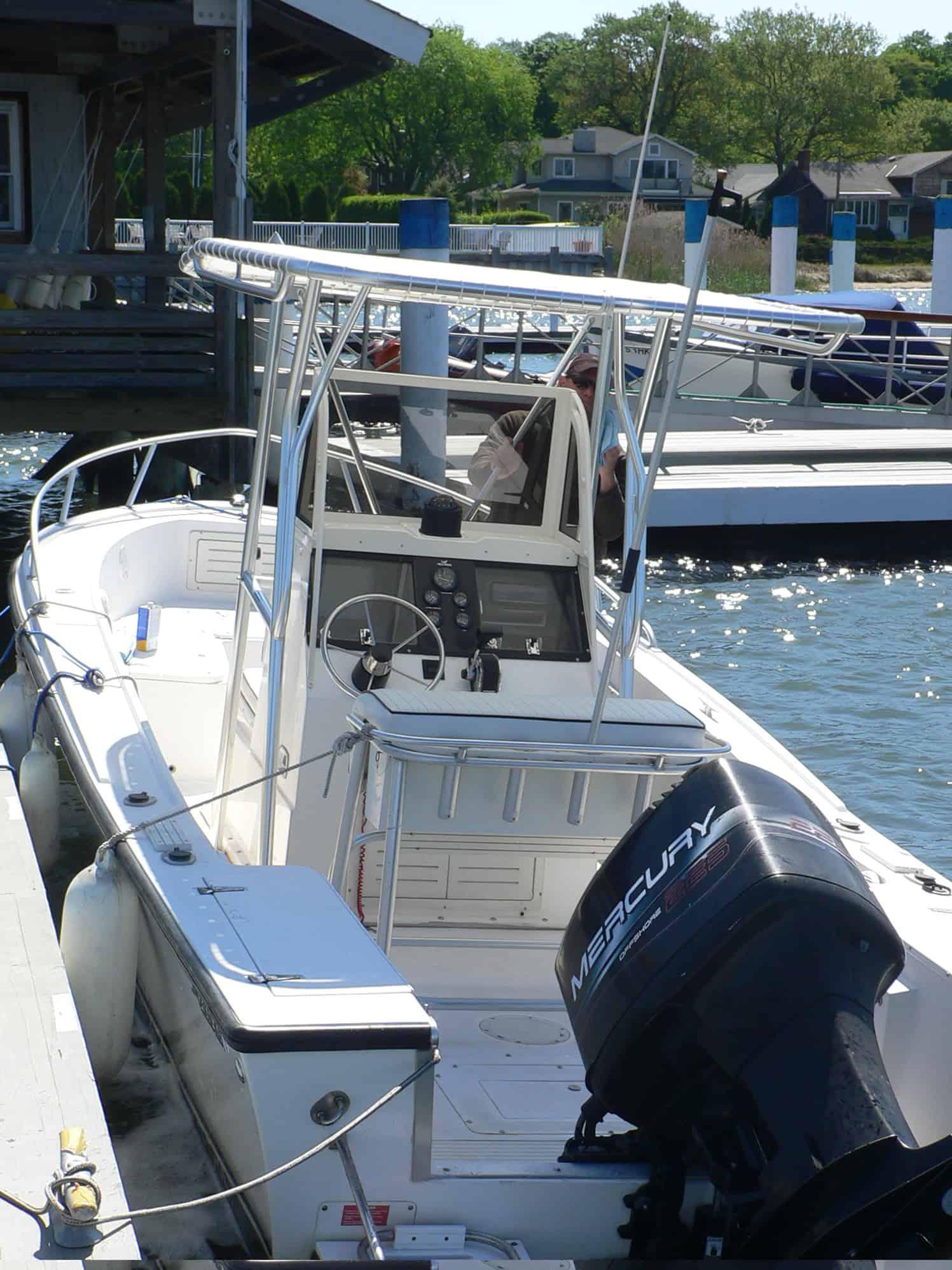 Atlantic Towers T-Top installed on a Mako 2211B/232 boat docked at a marina with a Mercury outboard engine visible.