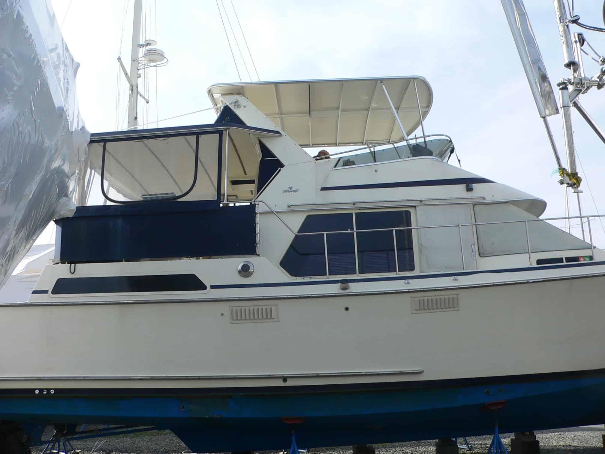 Atlantic Towers Top installed on Tollycraft 44/45 Cockpit MY boat, displayed on a trailer with protective cover.