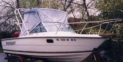 Atlantic Towers Arch installed on a Pursuit 2000 boat, showcasing a white hull and protective cover.