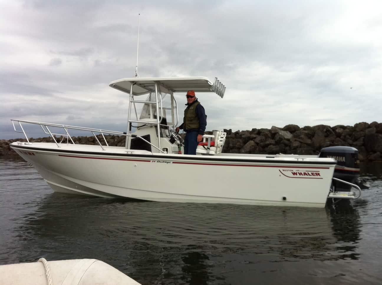 Atlantic Towers T-Top on a Boston Whaler 24 Outrage center console boat, providing shade and support for fishing activities.