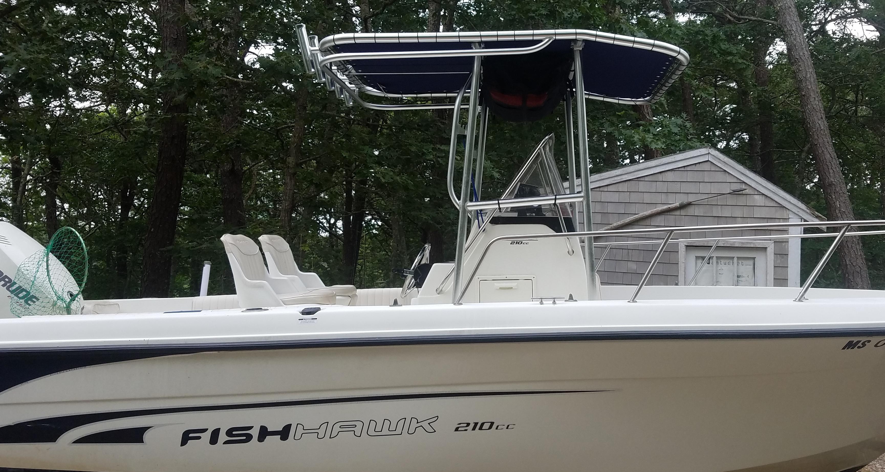 Atlantic Towers T-Top installed on a Bombardier Fishhawk 210cc boat with two white seats and a blue canopy top.