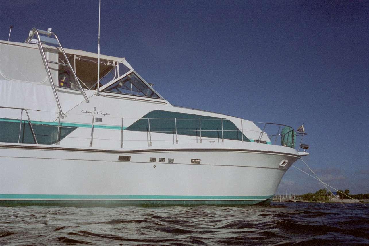 Atlantic Towers arch installed on the stern of a Chris Craft 381 Catalina motor yacht against a clear sky background