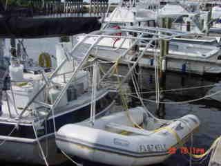 Atlantic Towers Arch installed on Morgan 41 Out Island sailboat docked among other boats in a marina.