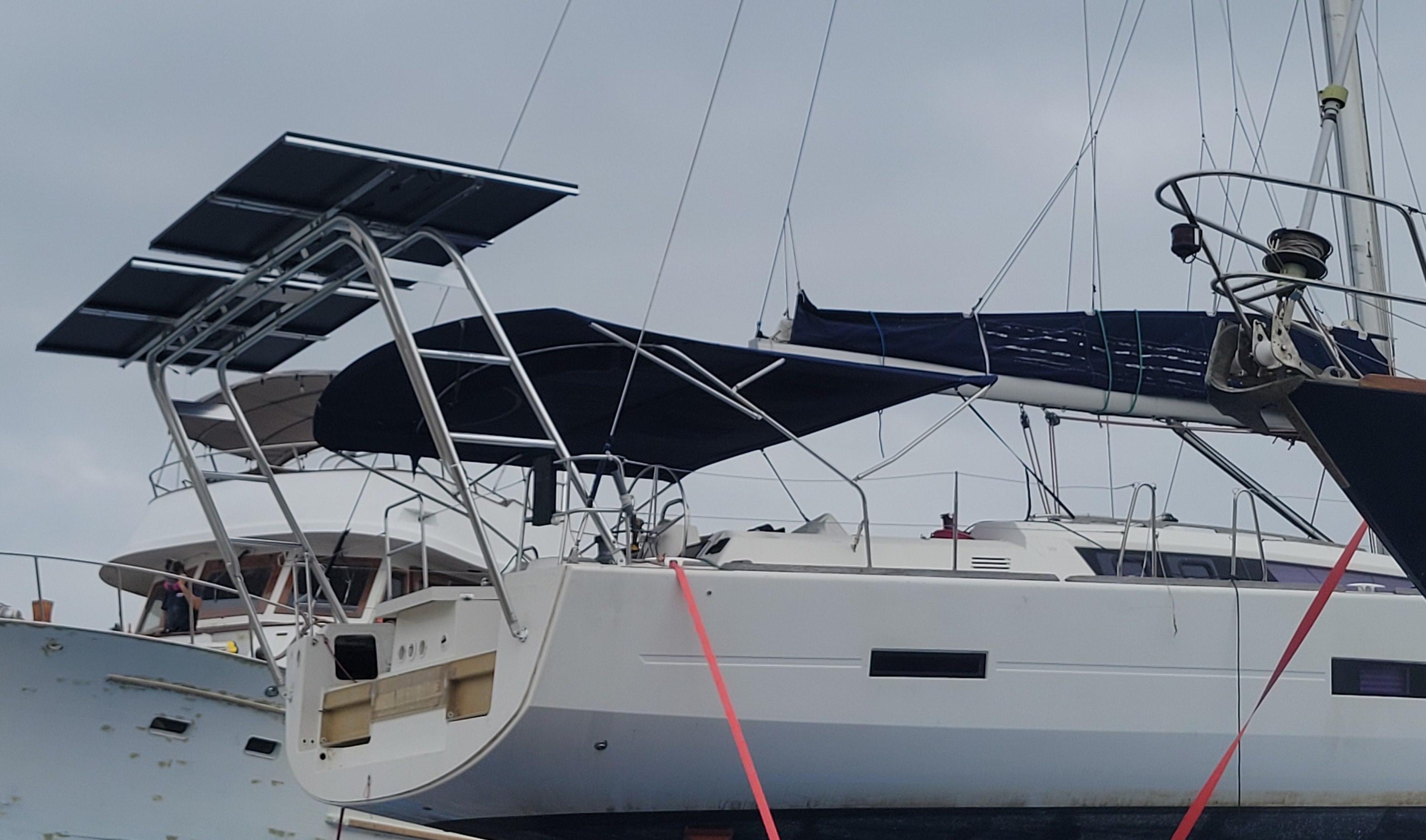 Atlantic Towers Arch installed on a Dufour Yachts vessel, featuring solar panels and an awning for shade.