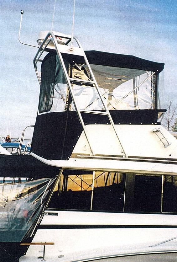 Alt text: Atlantic Towers arch installed on a Trojan F32 sedan boat, showcasing its sleek design and functionality.
