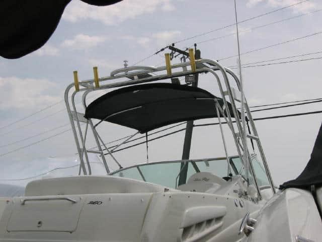 Atlantic Towers Arch installed on the back of a Sea Ray 260 Sundancer boat with black canopy and fishing rod holders.