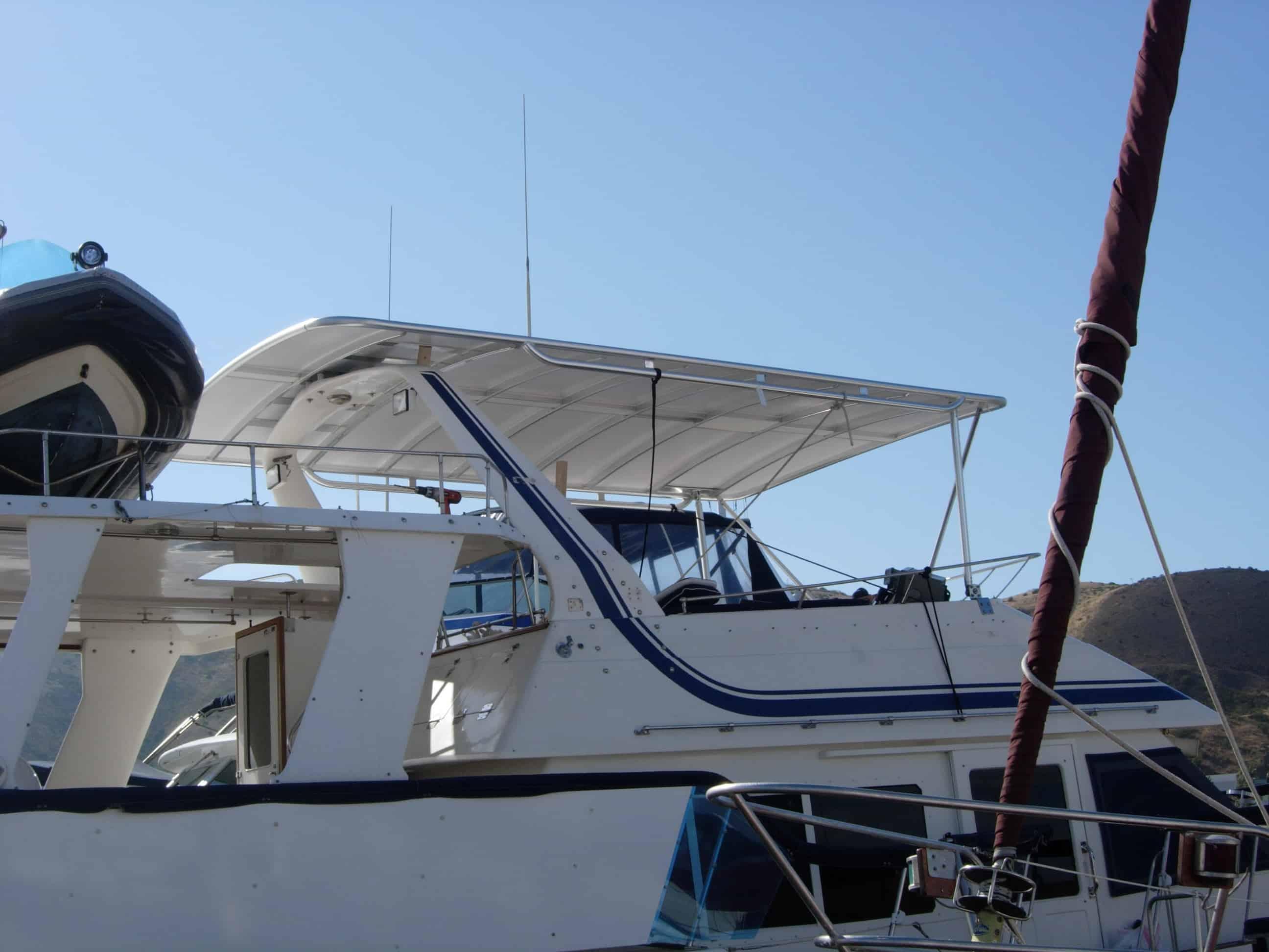 Atlantic Towers Top installed on a Kha Shing 51 Motor Yacht, showcasing the boat's upper deck and surroundings.