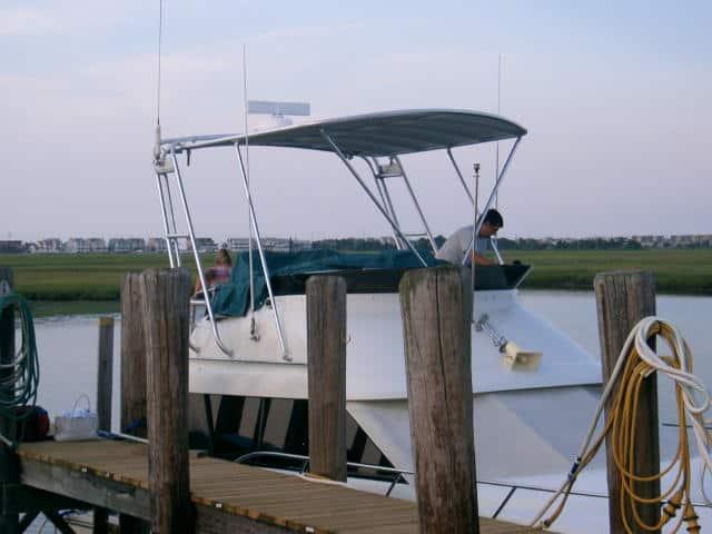 Atlantic Towers Top installed on a Silverton 34 C boat at a dock, with people preparing for departure.