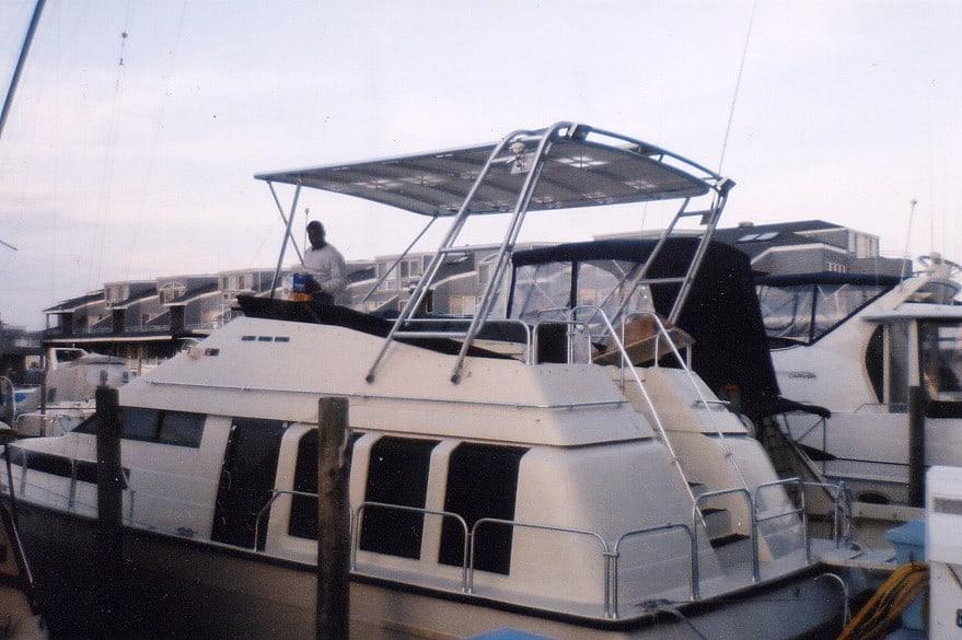 Atlantic Towers Top installed on a Mainship 41 Med Aft Cabin boat in a marina setting.