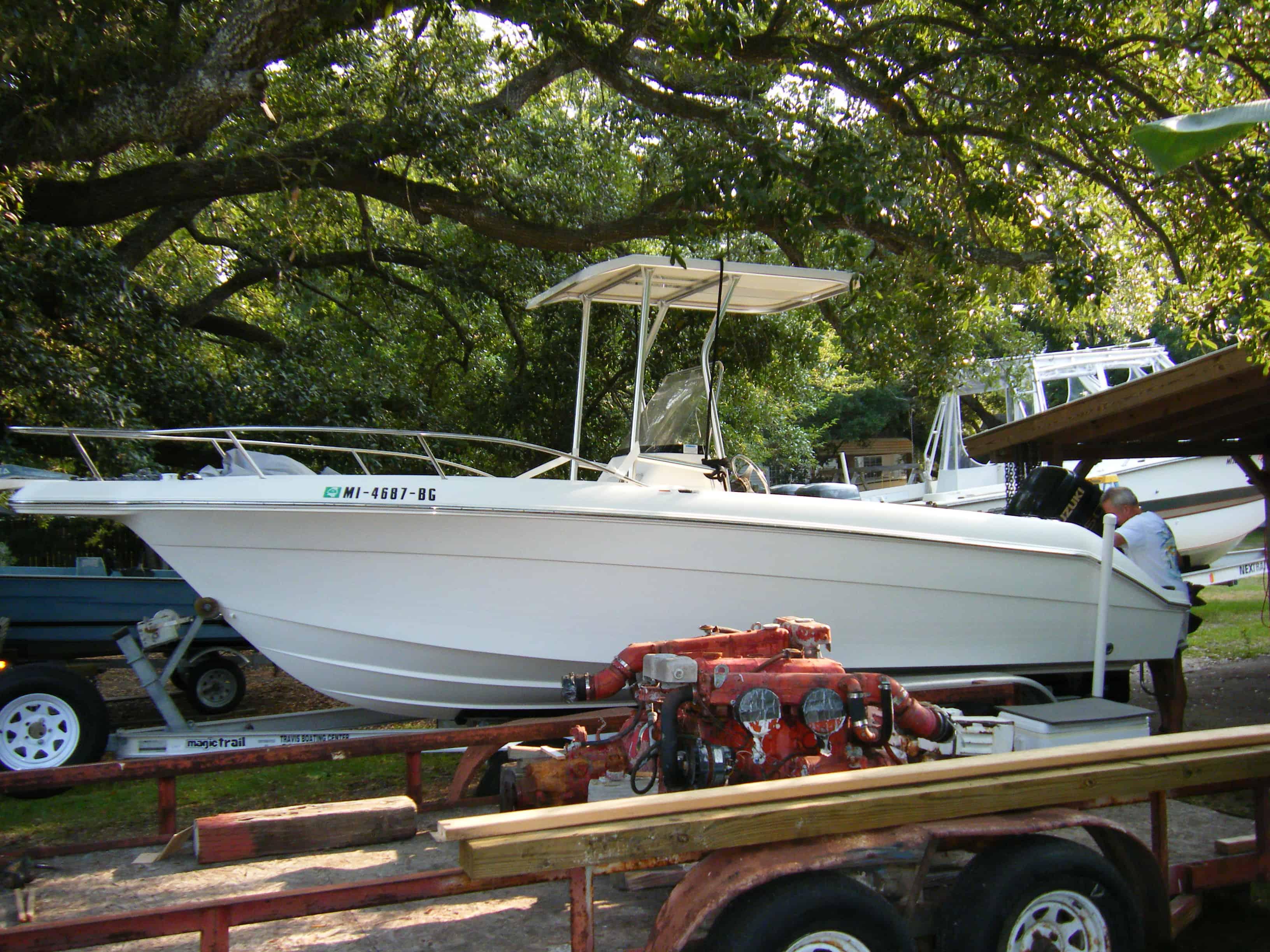 Atlantic Towers T-Top installed on a Wellcraft 210 Fisherman center console boat shown on water with fishing gear