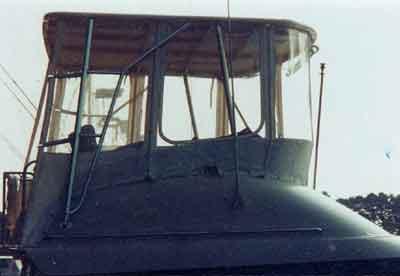 Atlantic Towers Top installed on a Silverton 37 Convertible boat, showcasing the helm area and canopy design.