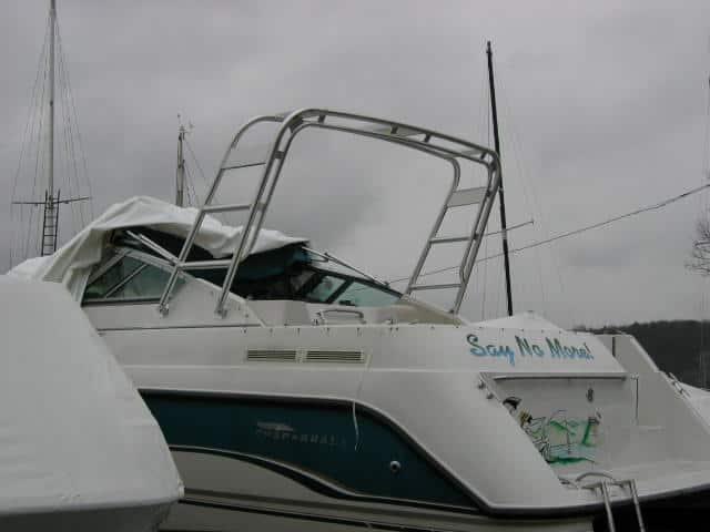 Chaparral 28/29 Signature boat docked with installed Atlantic Towers arch over the cabin on a cloudy day.