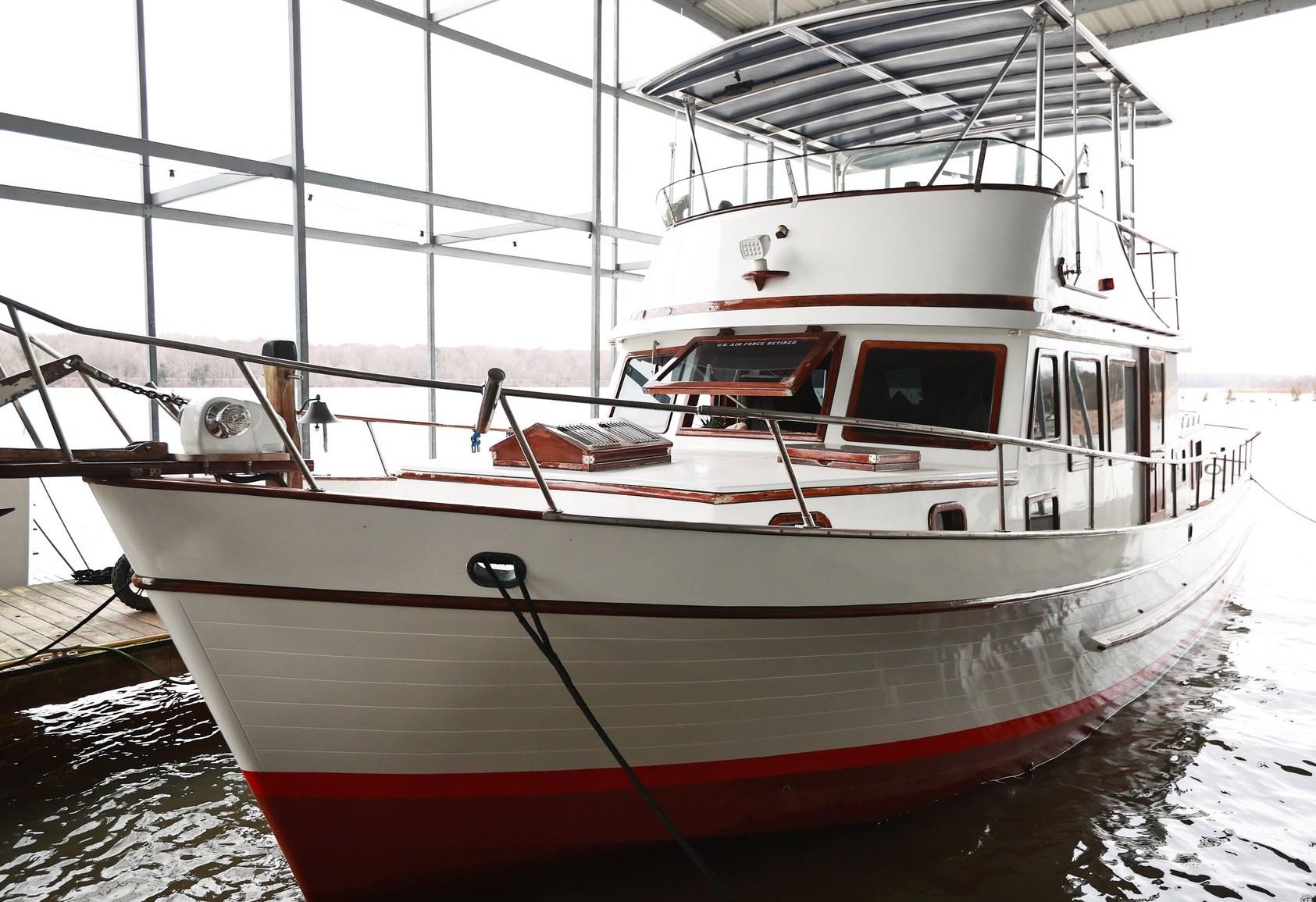 Atlantic Towers Top installed on a Marine Trader boat, docked in a boat house with large windows.