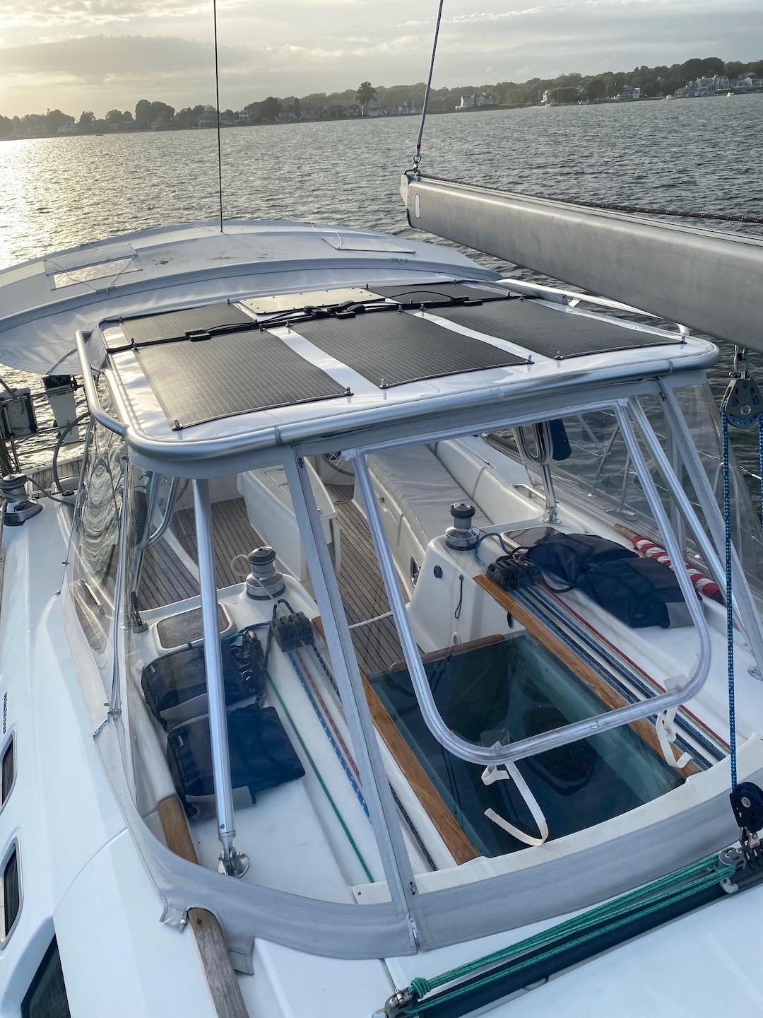 Atlantic Towers Top installed on a Beneteau sailboat cabin roof with rigging and equipment visible on deck at sunset.