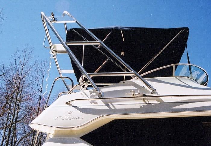 Atlantic Towers Arch installed on Bayliner 2858 Command Bridge boat with black canopy and clear sky background.