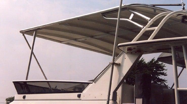 Atlantic Towers Top installed on a Carver 36/370 Aft Cabin boat, providing shade and shelter from the sun.