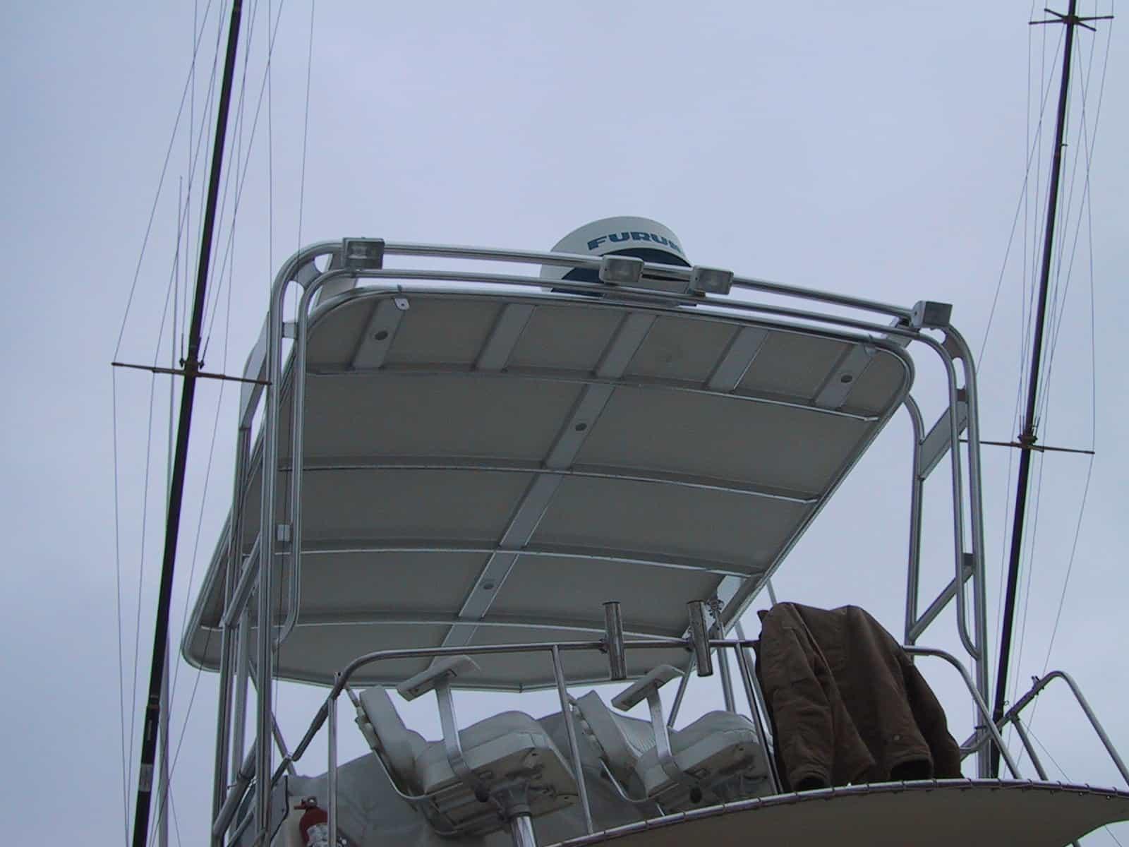 Atlantic Towers Top installed on an Egg Harbor 35 FB boat, featuring a sturdy aluminum frame and seating area.