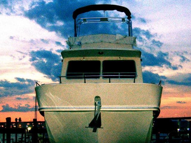 Atlantic Towers Arch installed on the bow of a Holiday Mansion 38 Coastal Barracuda boat at sunset.