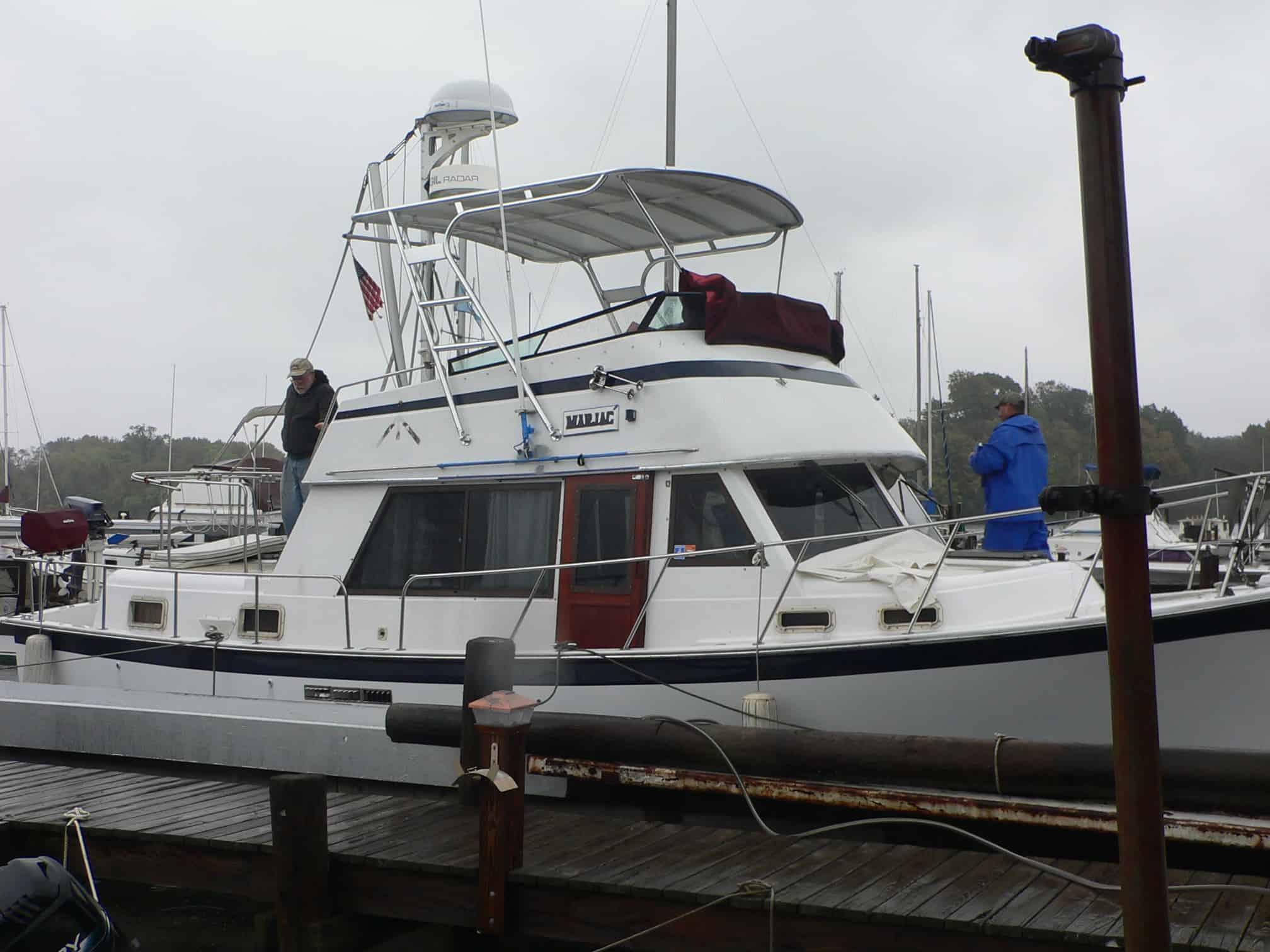 Atlantic Towers Top on a Priarie 36 American Trawler at the dock, with people onboard in rainy weather.