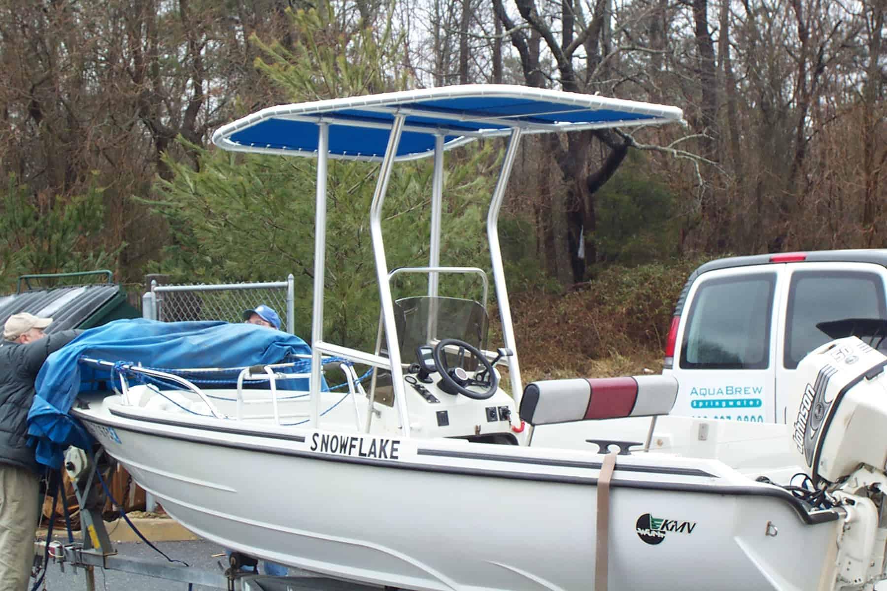 Atlantic Towers T-Top installed on a KMV 18 center console boat shown from the side on water