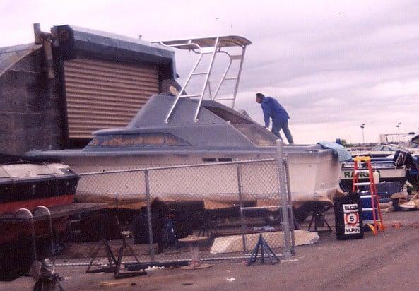 Atlantic Towers Top installed on a Silverton 26 FB boat at a marina, with a person working on the vessel.